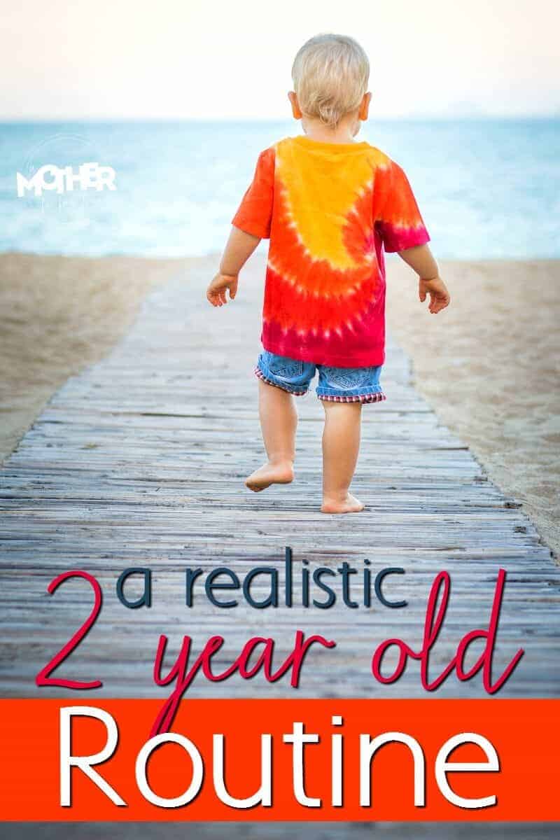  two year old toddler walking on the beach