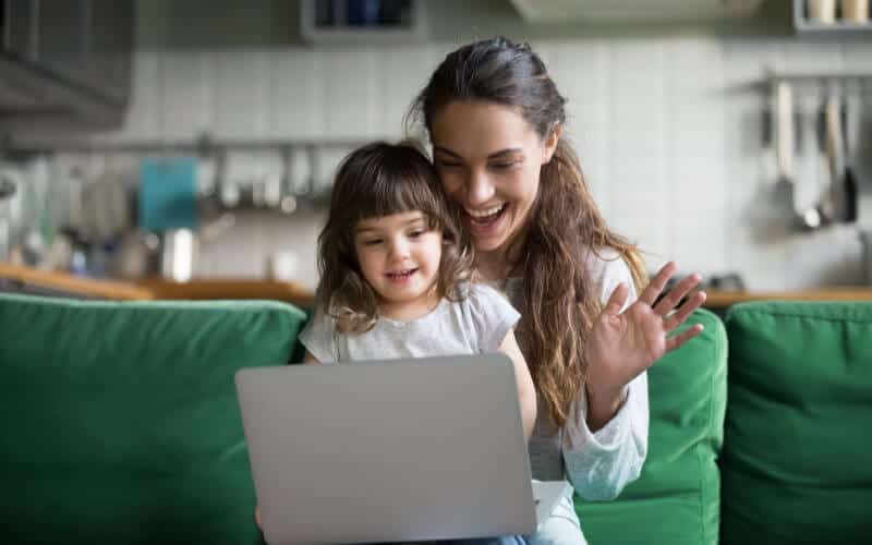 two year old sitting with her mom