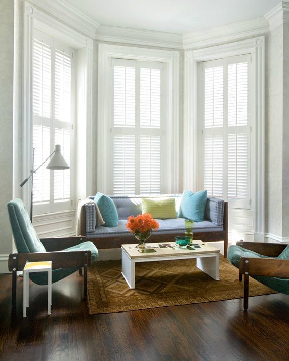 frank roop alcove bay windows plantation shutters wood settee sofa matching armchairs lounge chairs woven rug