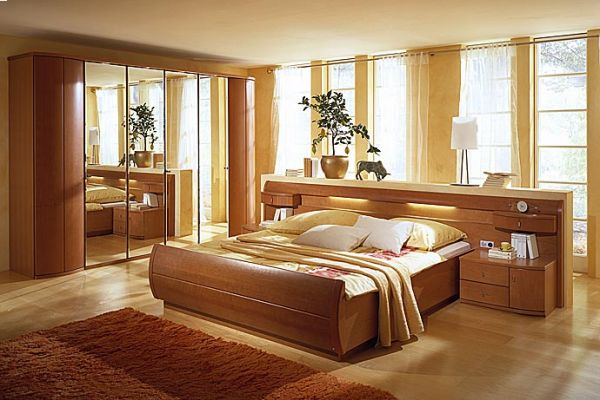Фото гармонично подобранной мебели в спальне размером в 15 кв. м.
